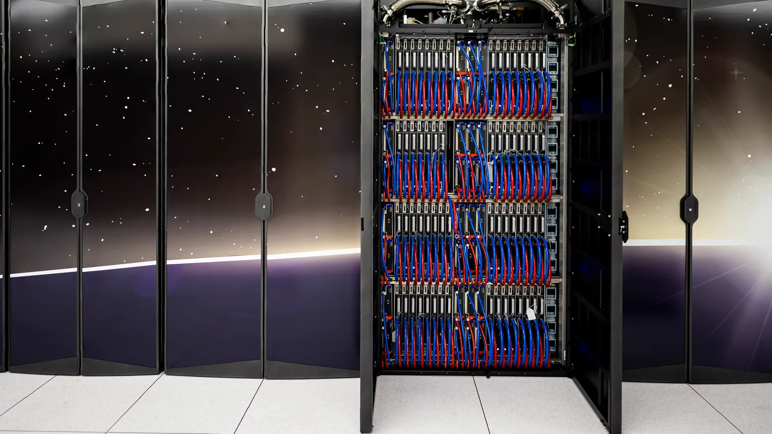Rows of compute equipment inside an open GPU cluster cabinet